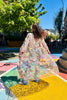 Roman Holiday Duster back blowing in the wind on colorful sidewalk