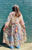 Roman Holiday Duster back detail tied against blue brick