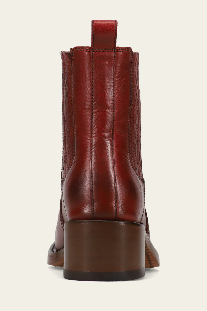 Frye ankle-high, chunky-heeled, brown leather boot with a square toe and side zipper. Heel view.