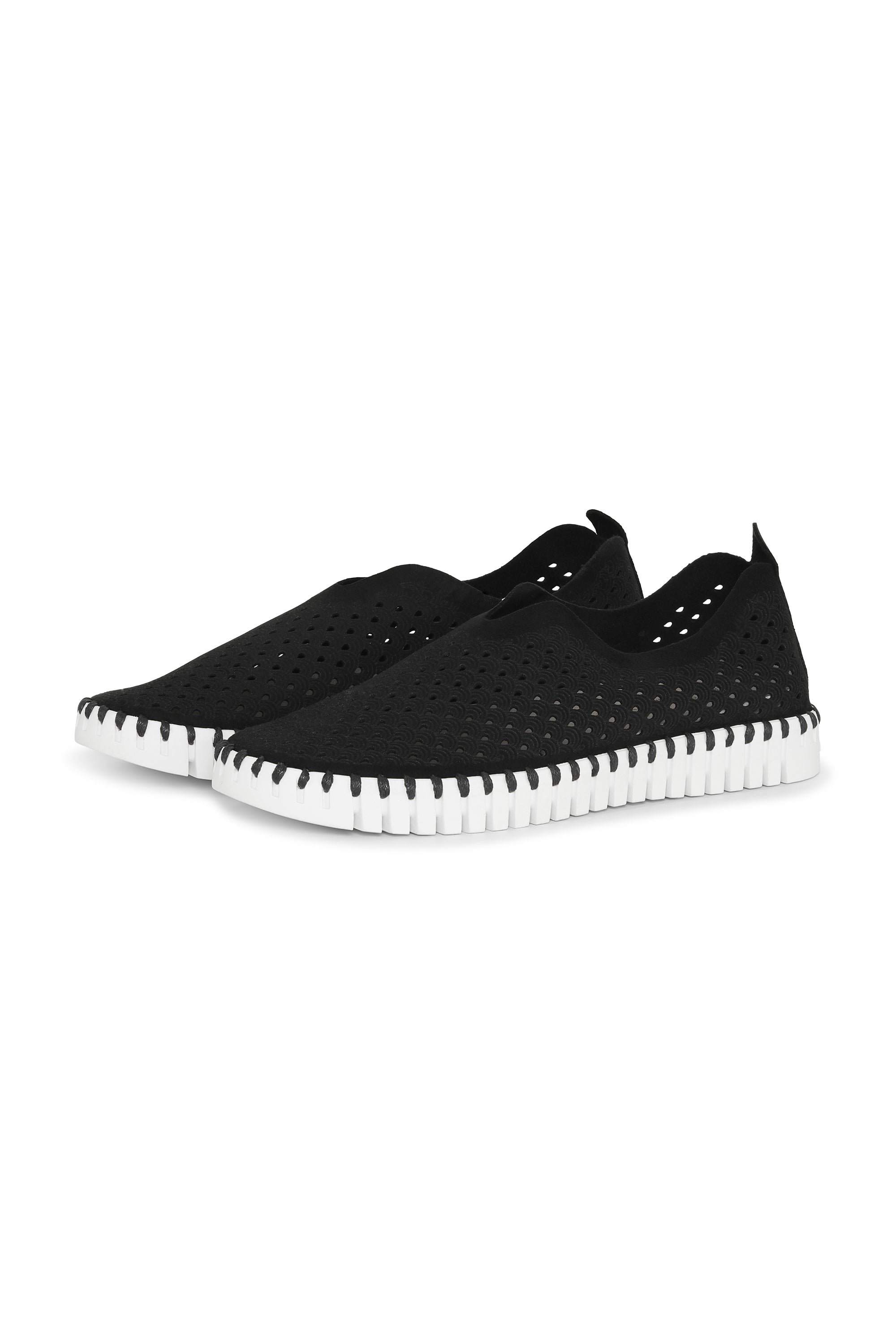 A pair of Black Ilse Jacobsen Tulip139 shoes with a laser cut pattern on the upper and a white sole.