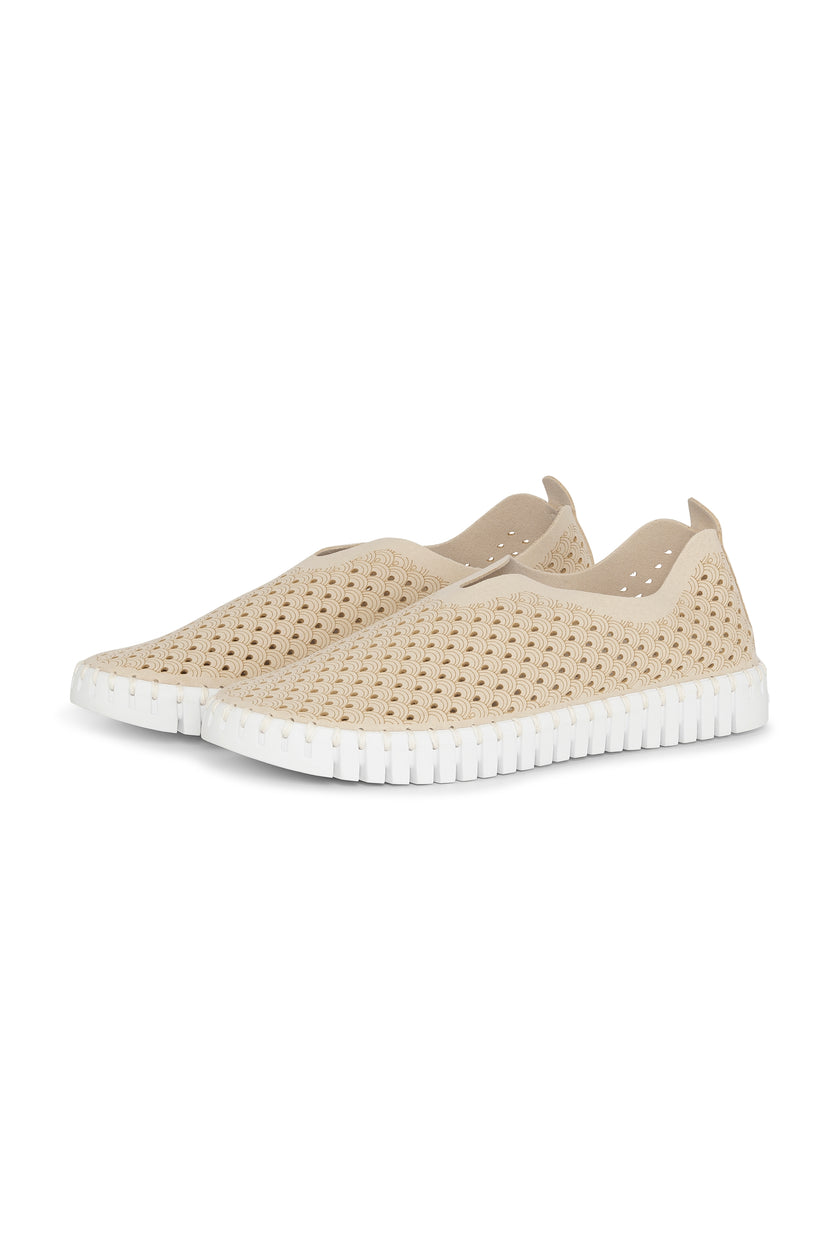 A pair of Kit Ilse Jacobsen Tulip 139 shoes with a laser cut pattern on the upper and a white sole