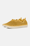A pair of Goldenrod Ilse Jacobsen Tulip139 shoes with a laser cut pattern on the upper and a white sole.