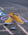 A pair of a Rachelle M exclusive colorway Seaside Stroll Ilse Jacobsen Tulip 139 shoes with a laser cut pattern on the upper and a white sole