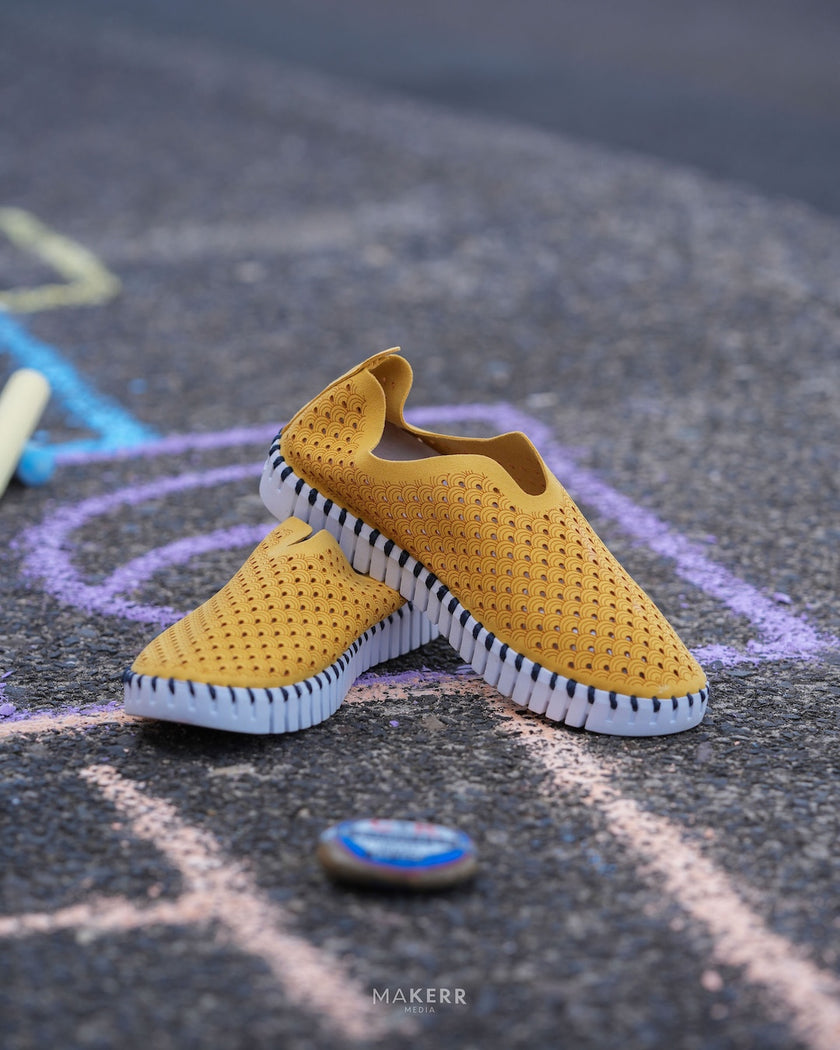 A pair of a Rachelle M exclusive colorway Seaside Stroll Ilse Jacobsen Tulip 139 shoes with a laser cut pattern on the upper and a white sole