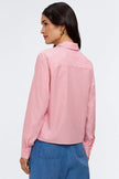 Woman wearing a pink striped shirt.