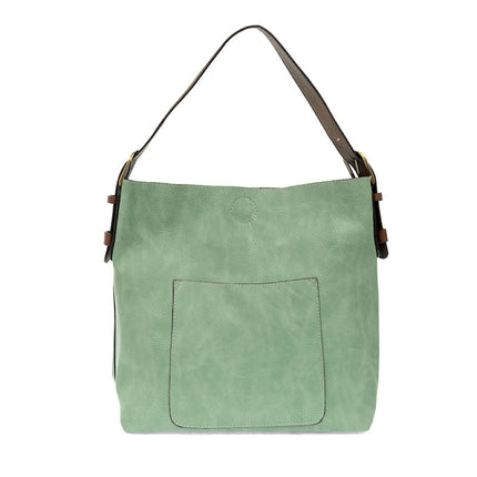Bermuda Green shoulder bag with brown leather accents on a white background