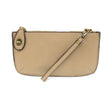 A beech wood-colored mini crossbody wristlet clutch with brass plated hardware and a printed lining, displayed with the wristlet strap visible