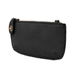 A black-colored mini crossbody wristlet clutch with brass plated hardware and a printed lining, displayed without straps
