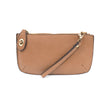 A camel-colored mini crossbody wristlet clutch with brass plated hardware and a printed lining, displayed with the wristlet strap visible