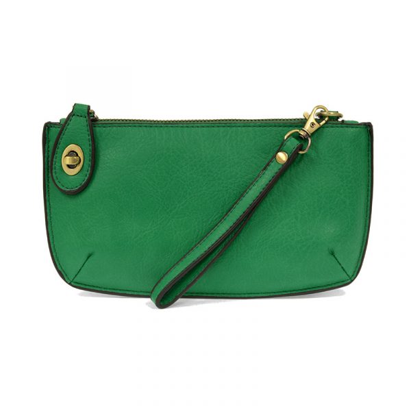 A clover-colored mini crossbody wristlet clutch with brass plated hardware and a printed lining, displayed with the wristlet strap visible
