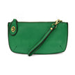 A clover-colored mini crossbody wristlet clutch with brass plated hardware and a printed lining, displayed with the wristlet strap visible