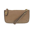 A dark khaki-colored mini crossbody wristlet clutch with brass plated hardware and a printed lining, displayed with the wristlet strap visible
