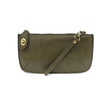 A dark moss-colored mini crossbody wristlet clutch with brass plated hardware and a printed lining, displayed with the wristlet strap visible