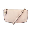 An eggshell pink-colored mini crossbody wristlet clutch with brass plated hardware and a printed lining, displayed with the wristlet strap visible