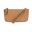 A golden oak-colored mini crossbody wristlet clutch with brass plated hardware and a printed lining, displayed with the wristlet strap visible