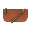 A maple-colored mini crossbody wristlet clutch with brass plated hardware and a printed lining, displayed with the wristlet strap visible