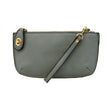 A mineral blue-colored mini crossbody wristlet clutch with brass plated hardware and a printed lining, displayed with the wristlet strap visible
