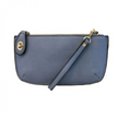 A periwinkle-colored mini crossbody wristlet clutch with brass plated hardware and a printed lining, displayed with the wristlet strap visible