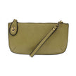 A willow green-colored mini crossbody wristlet clutch with brass plated hardware and a printed lining, displayed with the wristlet strap visible