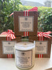 Rachelle M Coastal Candle with cardboard packaging and ribbon