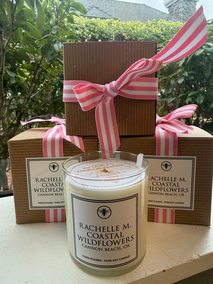Custom Rachelle M “Coastal Wildflowers” candle with cardboard packaging and ribbon