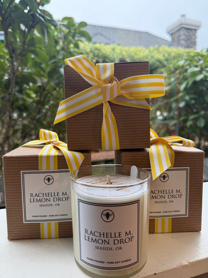 Custom Rachelle M “Lemon Drop” candle with cardboard packaging and ribbon