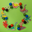 Do It Yourself Wood Garland dinosaurs colored in