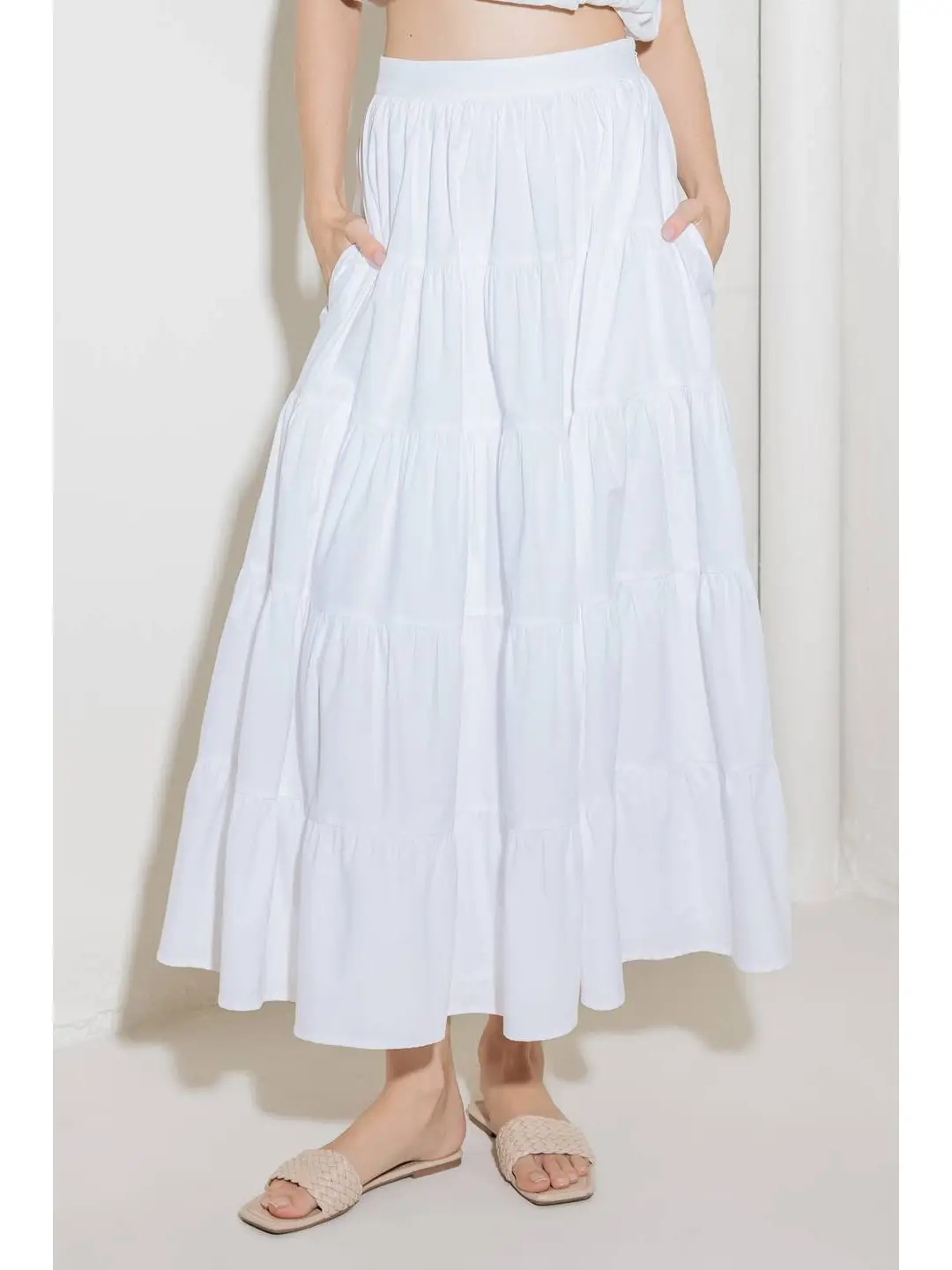 A solid woven tiered full midi skirt white front