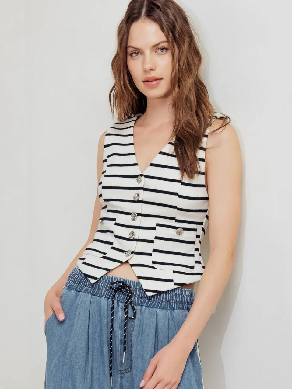 A striped woven vest black cream front