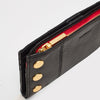 black/brushed gold red zip
