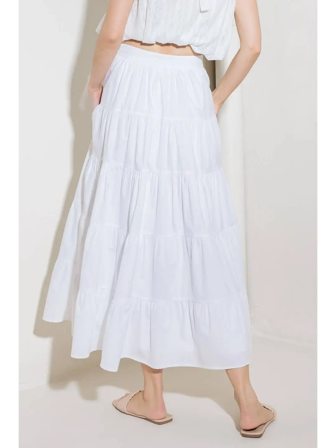 A solid woven tiered full midi skirt white back