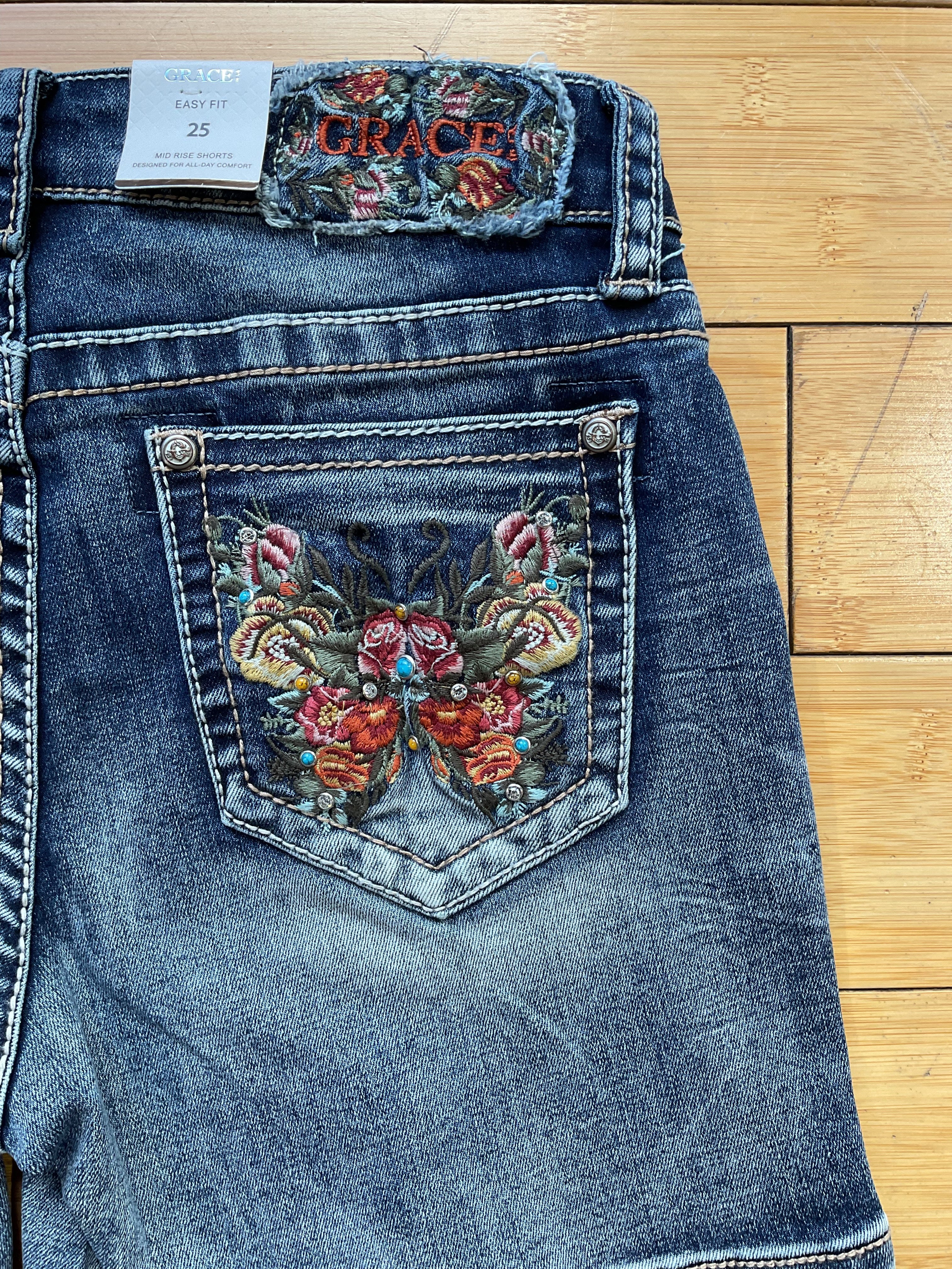 Grace denim stud and butterfly embroidered short-back pocket detail