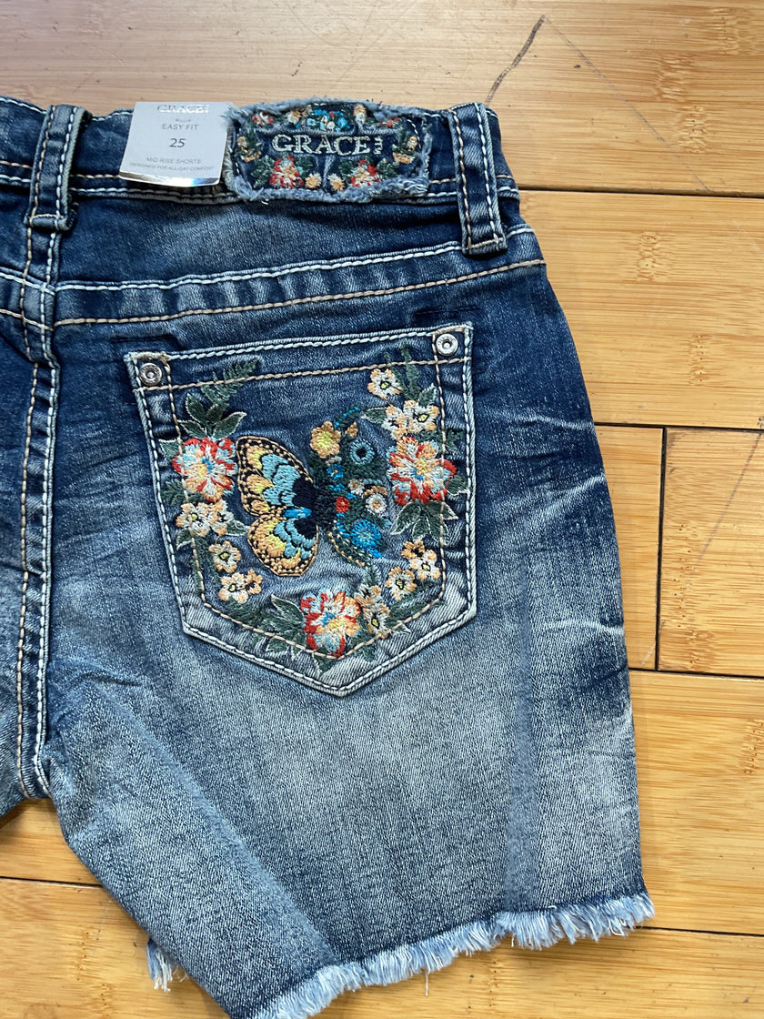 Grace denim butterfly/floral embroidered frayed hem short-back pocket detail