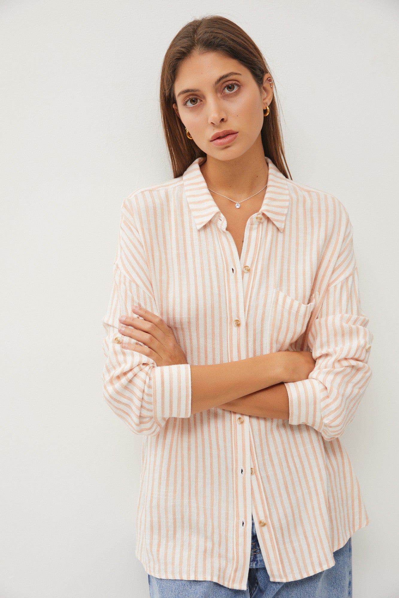 Krystal Striped Roll Up Sleeve Button Down Linen Shirt model crossed arms