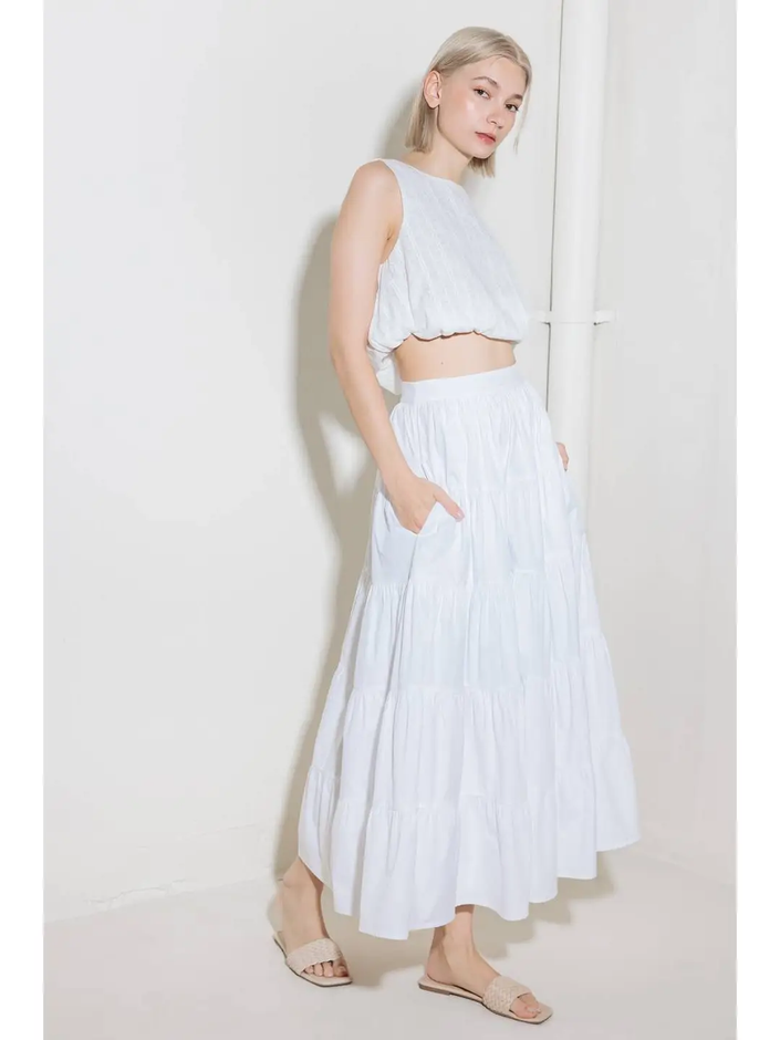 A solid woven tiered full midi skirt white side