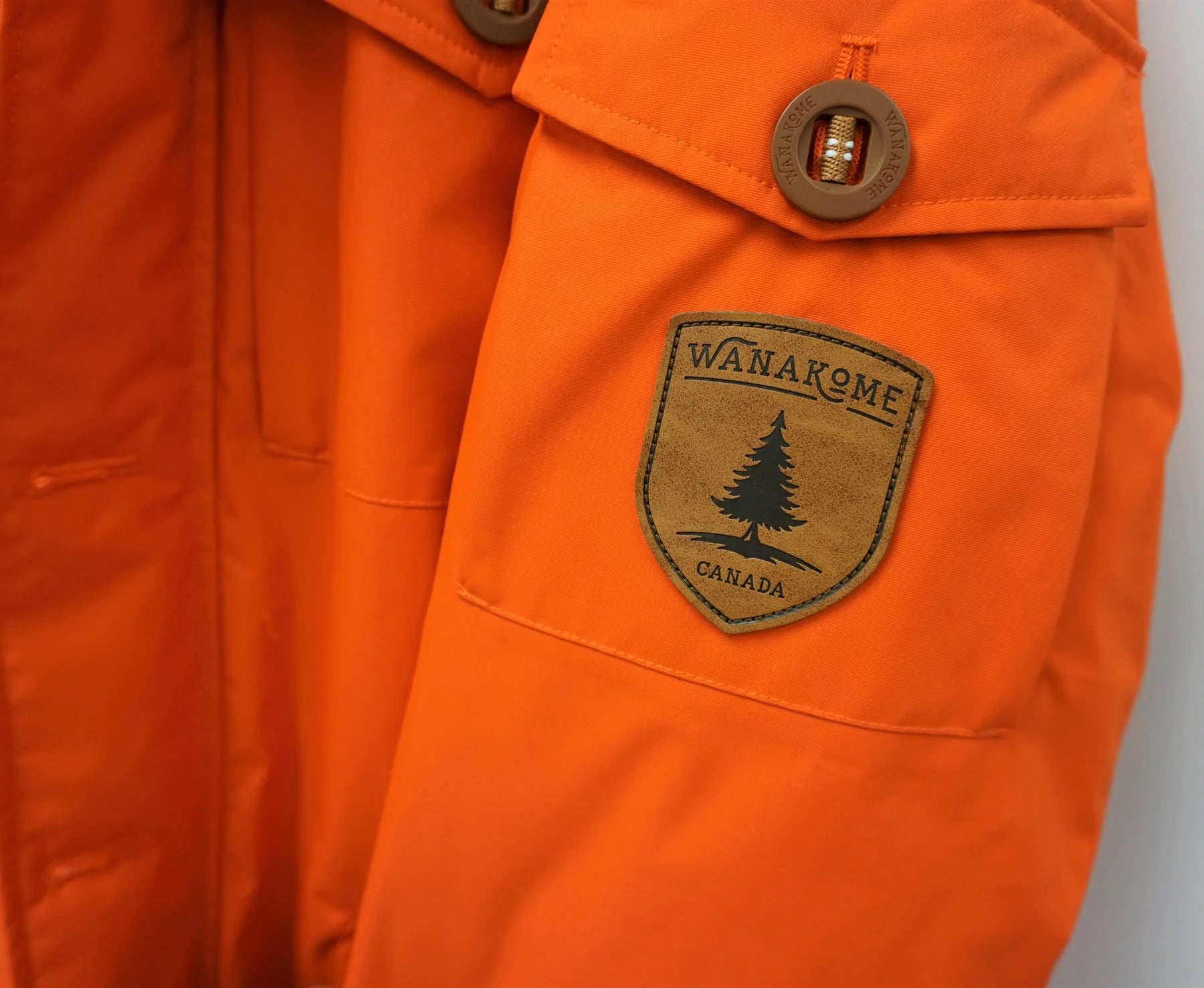 Wanakome Men's Icarus Parka | Orange patch