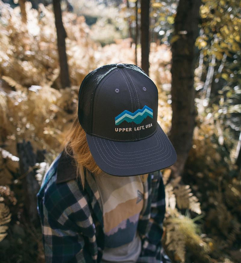 The Great PNW Expedition Trucker Hat pose