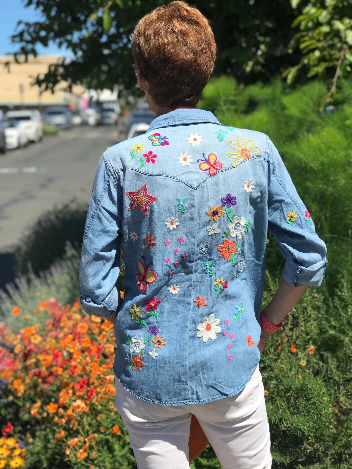 Kelly Sketchbook Star Butterfly & Floral Embroidery - Denim model in the street back